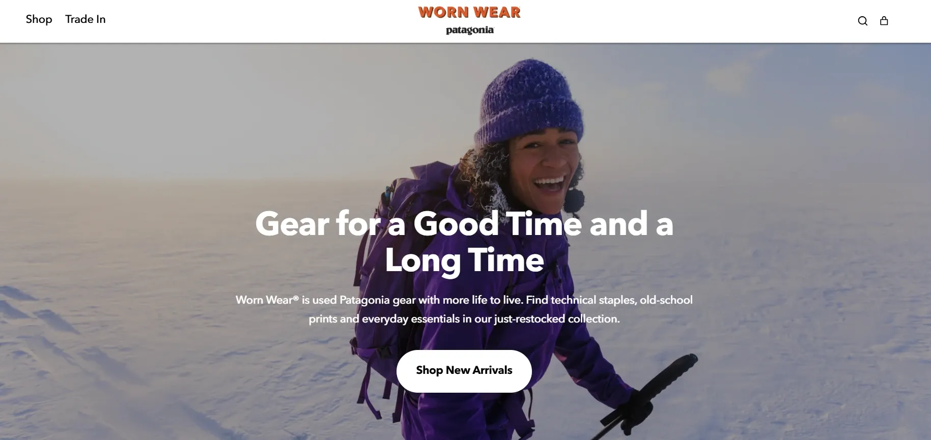 Patagonia’s Worn wear homepage showing a woman smiling in snowy outdoors