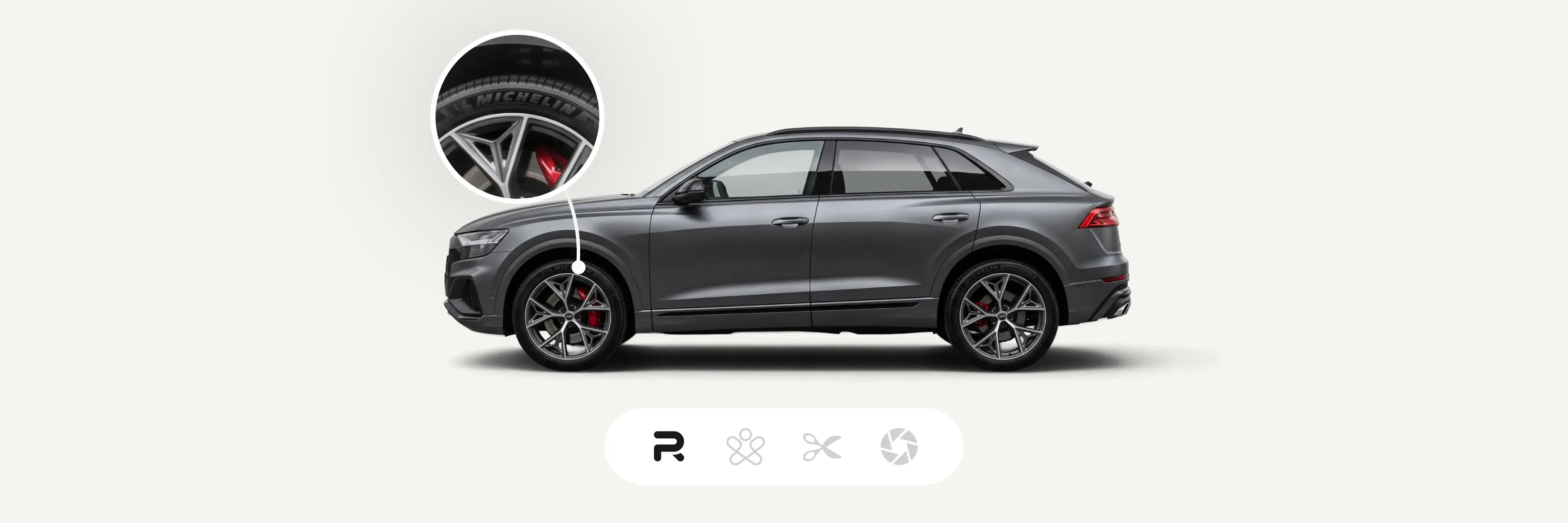 Dark gray SUV with red brake calipers and Michelin tires, zoomed view of the wheel. Icons below indicate options or features.
