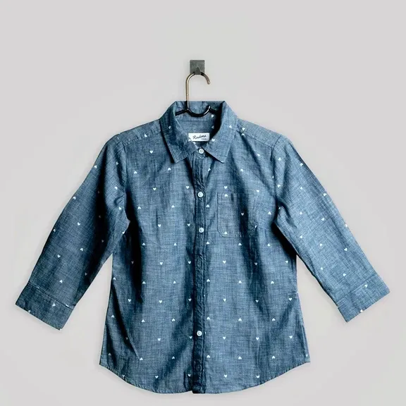 The same denim shirt relit by the Photoroom API: brighter, crisper fabric