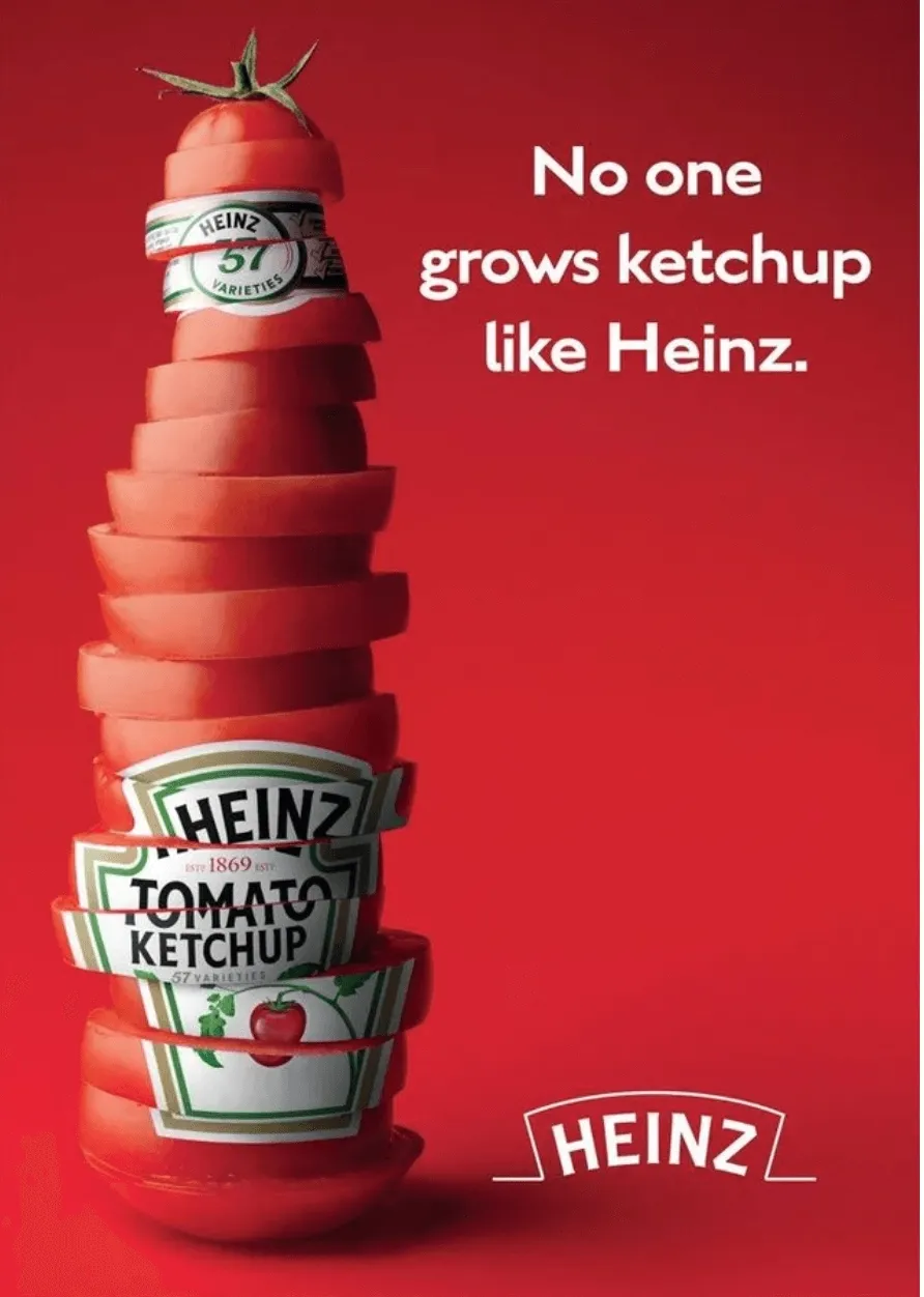 Creative advertisement showing a stack of tomato slices shaped like a Heinz ketchup bottle with the label wrapped around it and a real tomato top, set against a bold red background. The text "No one grows ketchup like Heinz." is displayed above, emphasizing the brand's uniqueness.